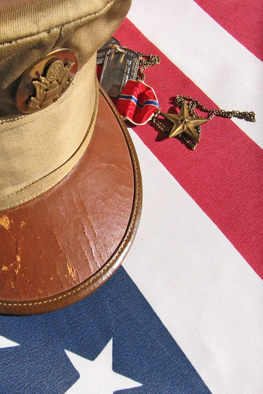 Military items sitting atop an American flag