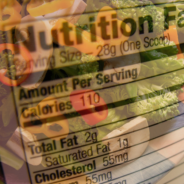 A nutrition label hovers over a salad full of colorful vegetables. Photos © FreeImages.com/Bob Smith
